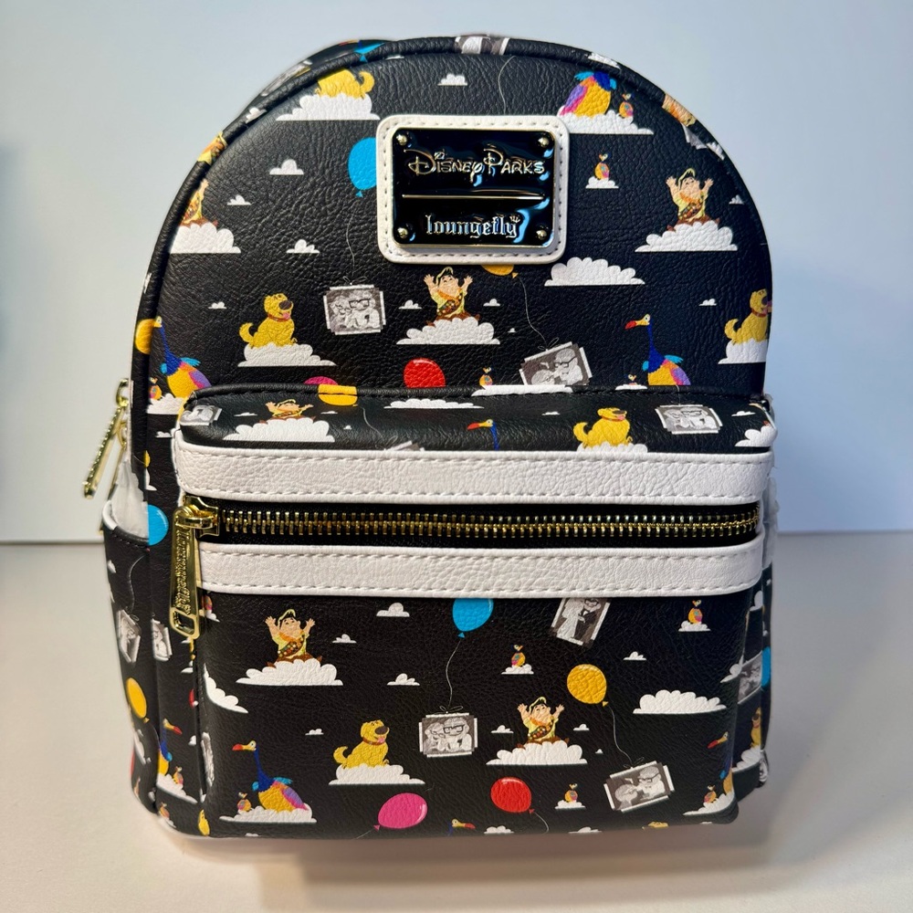 NWT. Disney UP Loungefly backpack. Featuring Up Characters And Balloons.